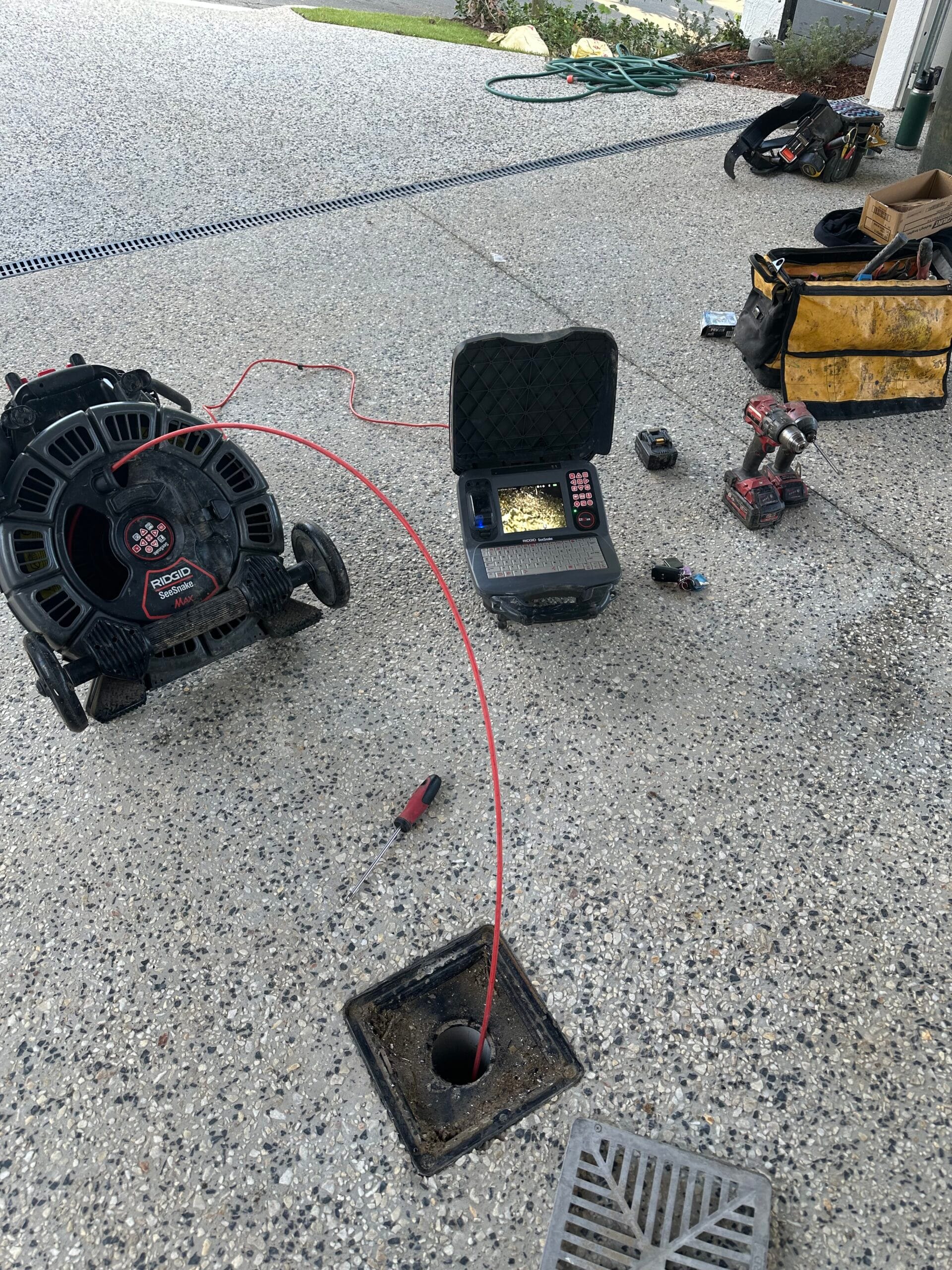 CCTV drain camera and monitor used to inspect a blocked drain