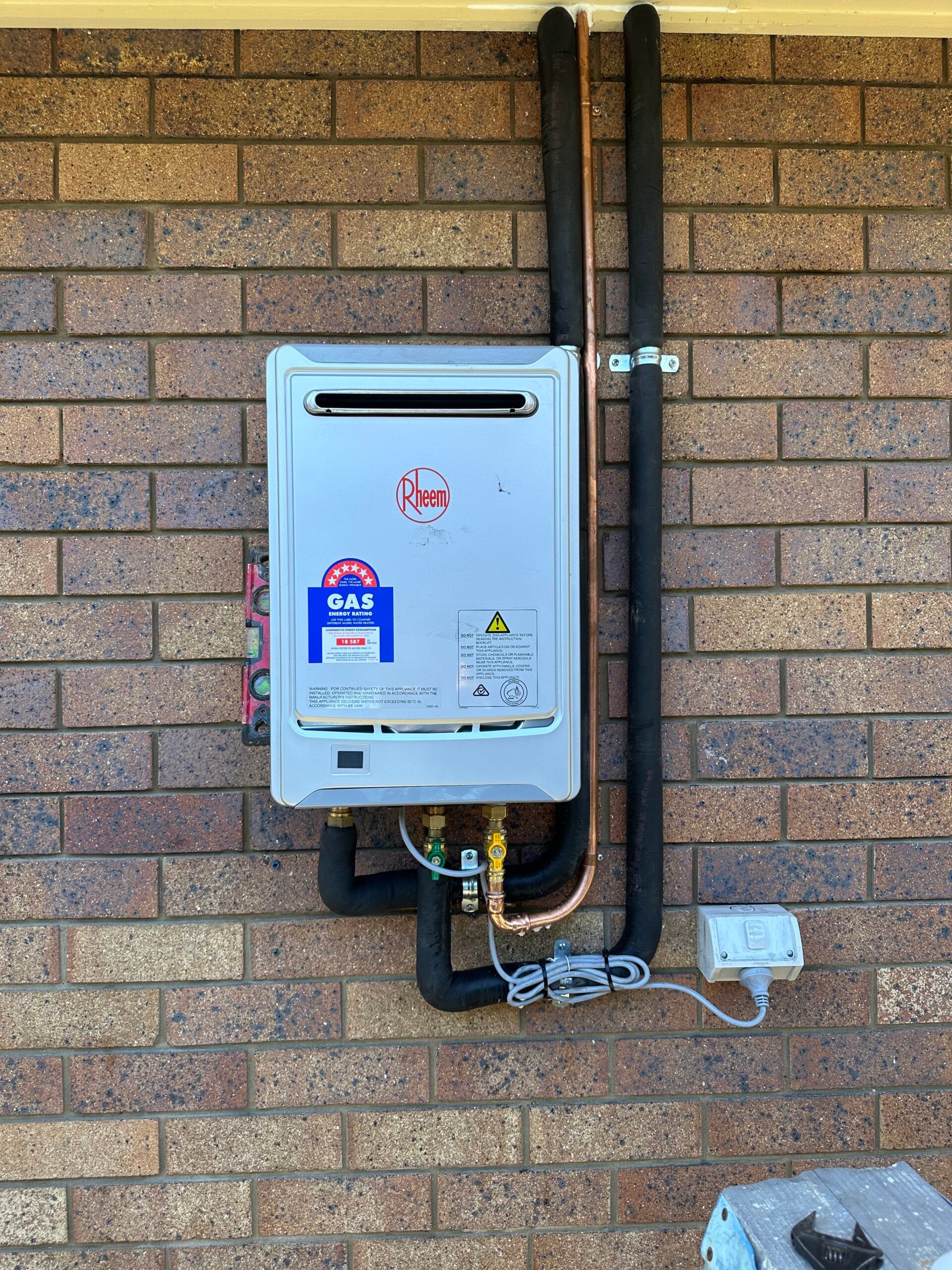 Rheem continuous-flow gas hot water system installed by Oz Plumbing & Gas