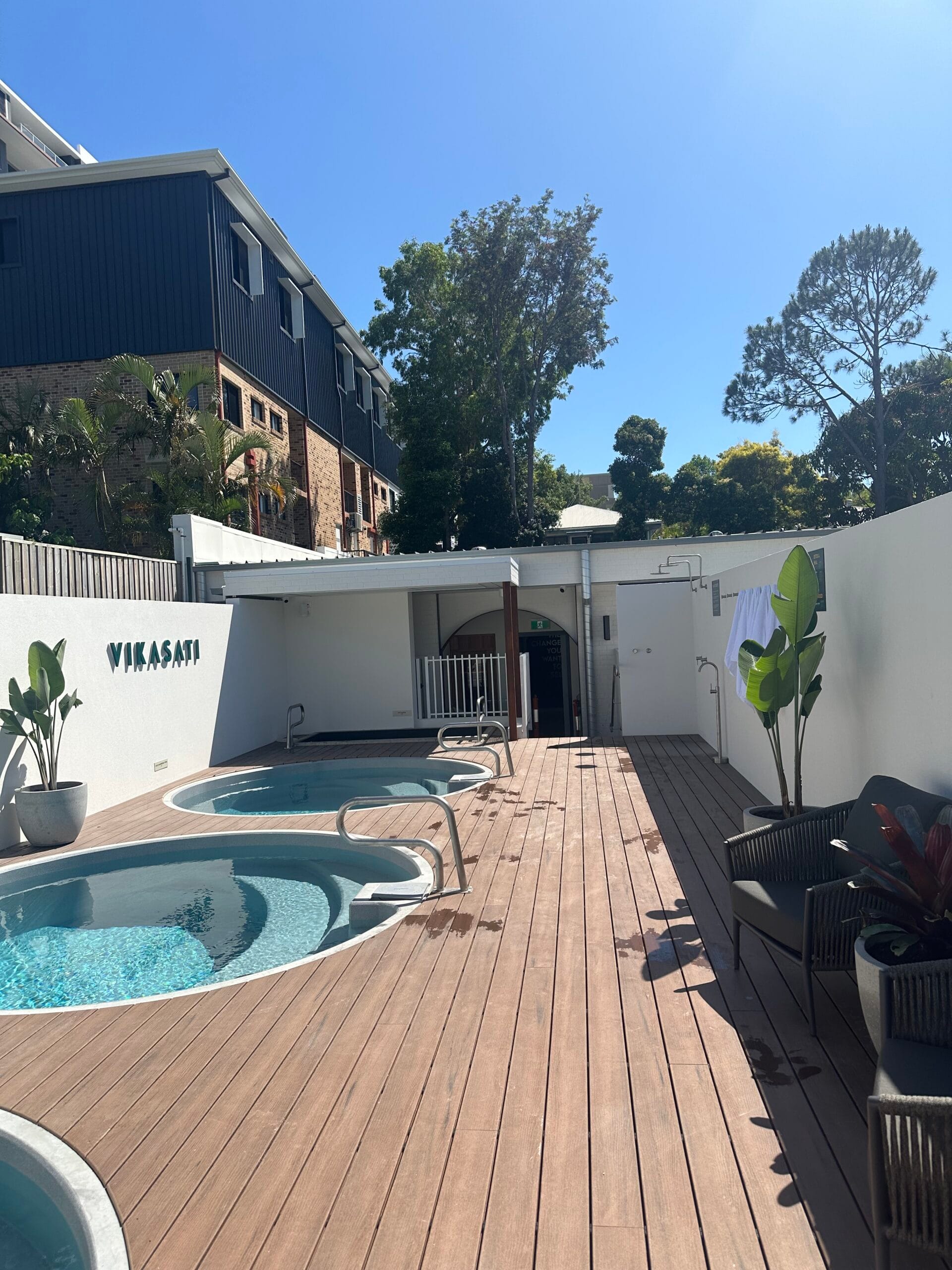 Completed Vikasati Gold Coast bathhouse with plunge pools and outdoor plumbing fixtures